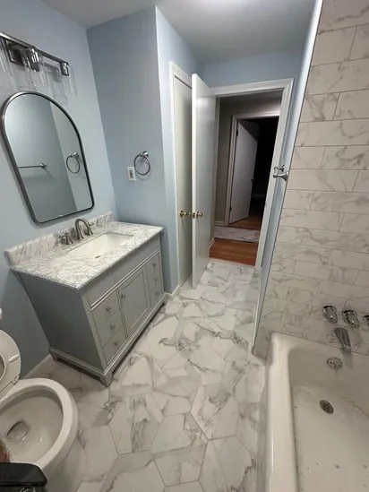 Bathroom Remodeling Project featuring new vanity, flooring, and wall finishes