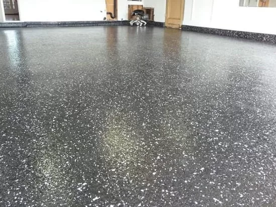 Granulated epoxy floor showing even flake distribution and a polished surface